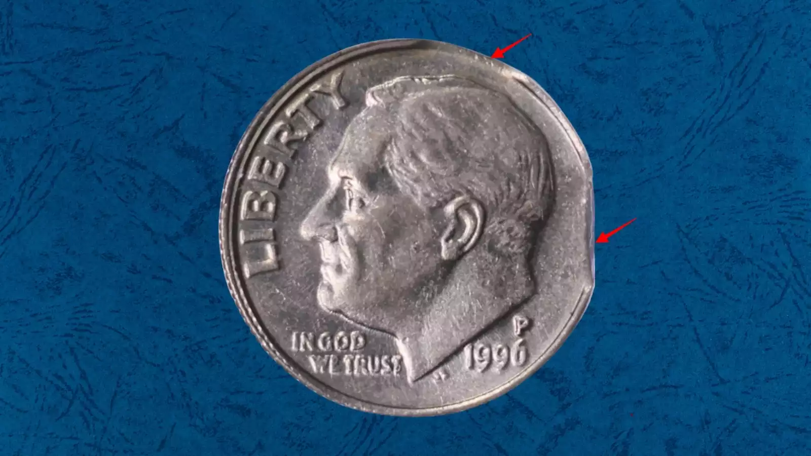 1996 dime clipped planchet error showing curved section of metal missing from coin edge