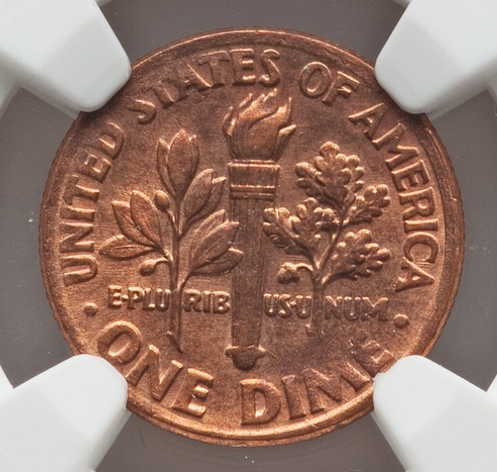 1996 dime missing clad layer error showing exposed copper core where nickel outer layer failed to bond
