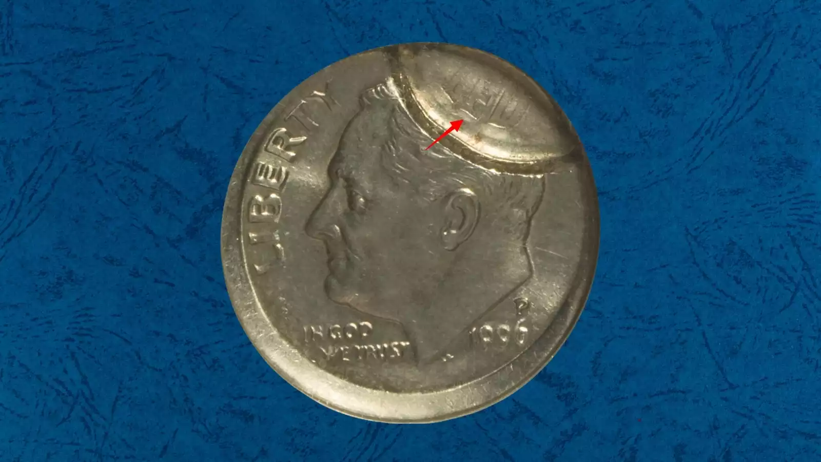 1996 dime brockage or struck-through error showing incuse mirror-image impression or debris mark on coin surface